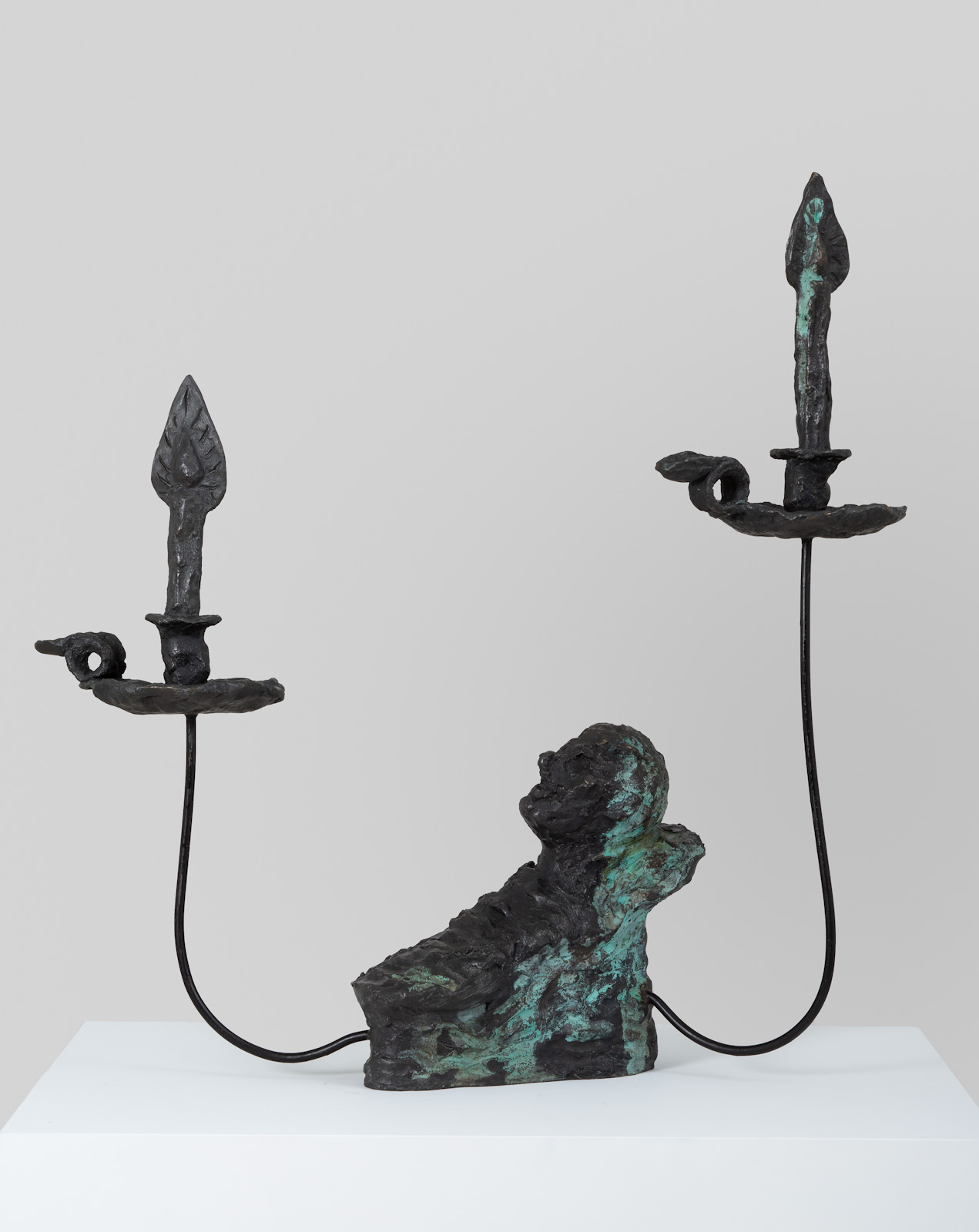 <em>head resting with two candles</em>, 2017<br />Bronze and steel<br />27 1/2 x 23 1/2 x 18 inches (69.9 x 58.4 x 43.8 cm)